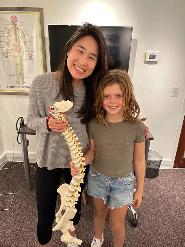 Smiling with a young girl.